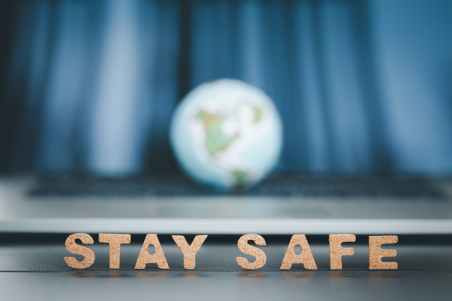 stay safe word with globe ball on blue tone background, coronavirus prevention concept